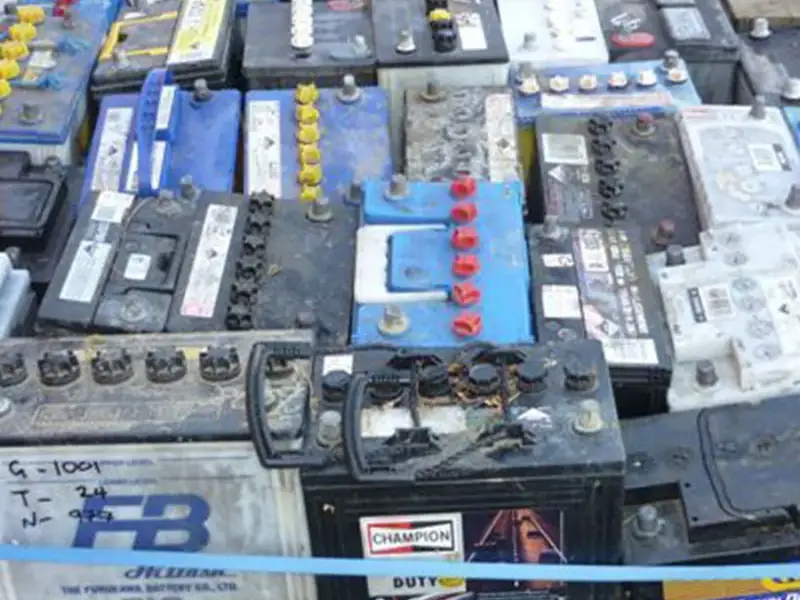 Used lead-acid car batteries stacked on a pallet at the Ingleburn yard