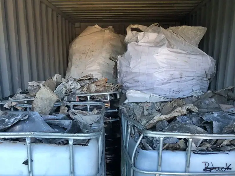 Scrap lead packed in bulka bags and stillages inside a shipping container