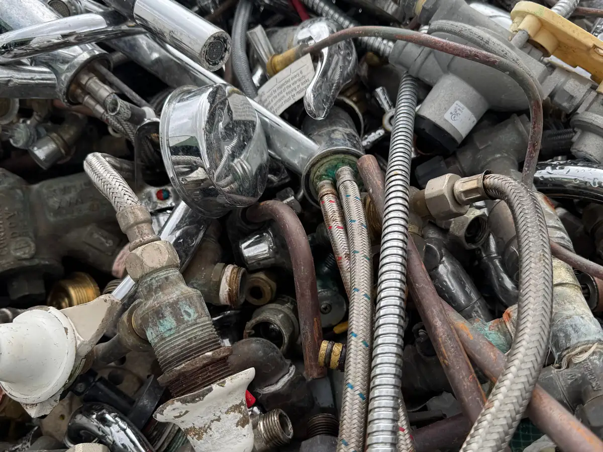 Scrap taps, mixers, brass fittings and braided hoses at the Ingleburn yard